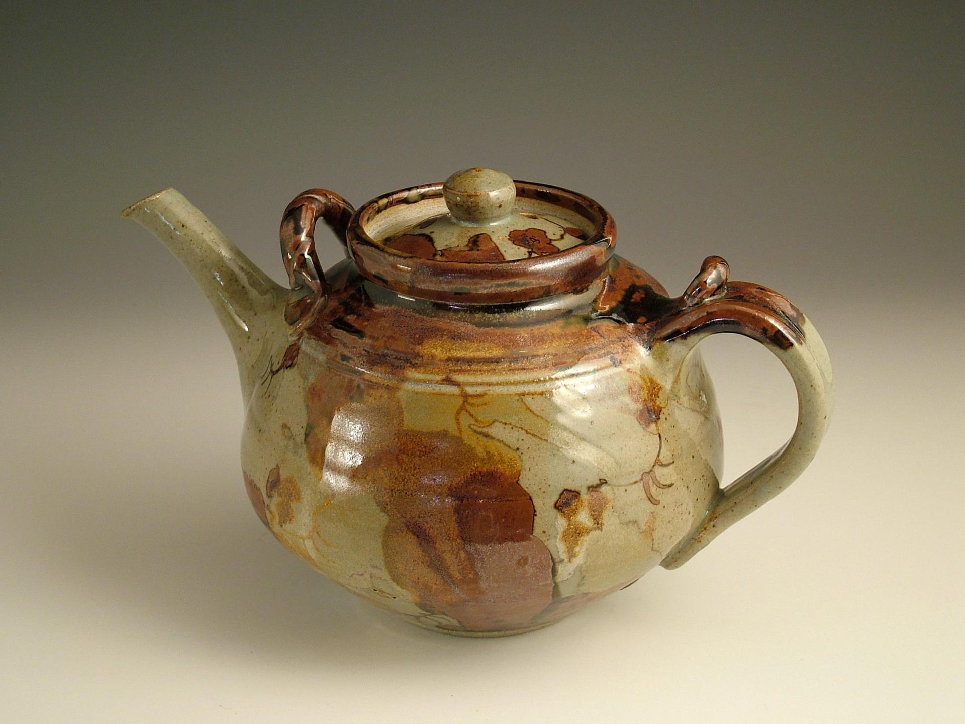 Iron brush decorated stoneware teapot