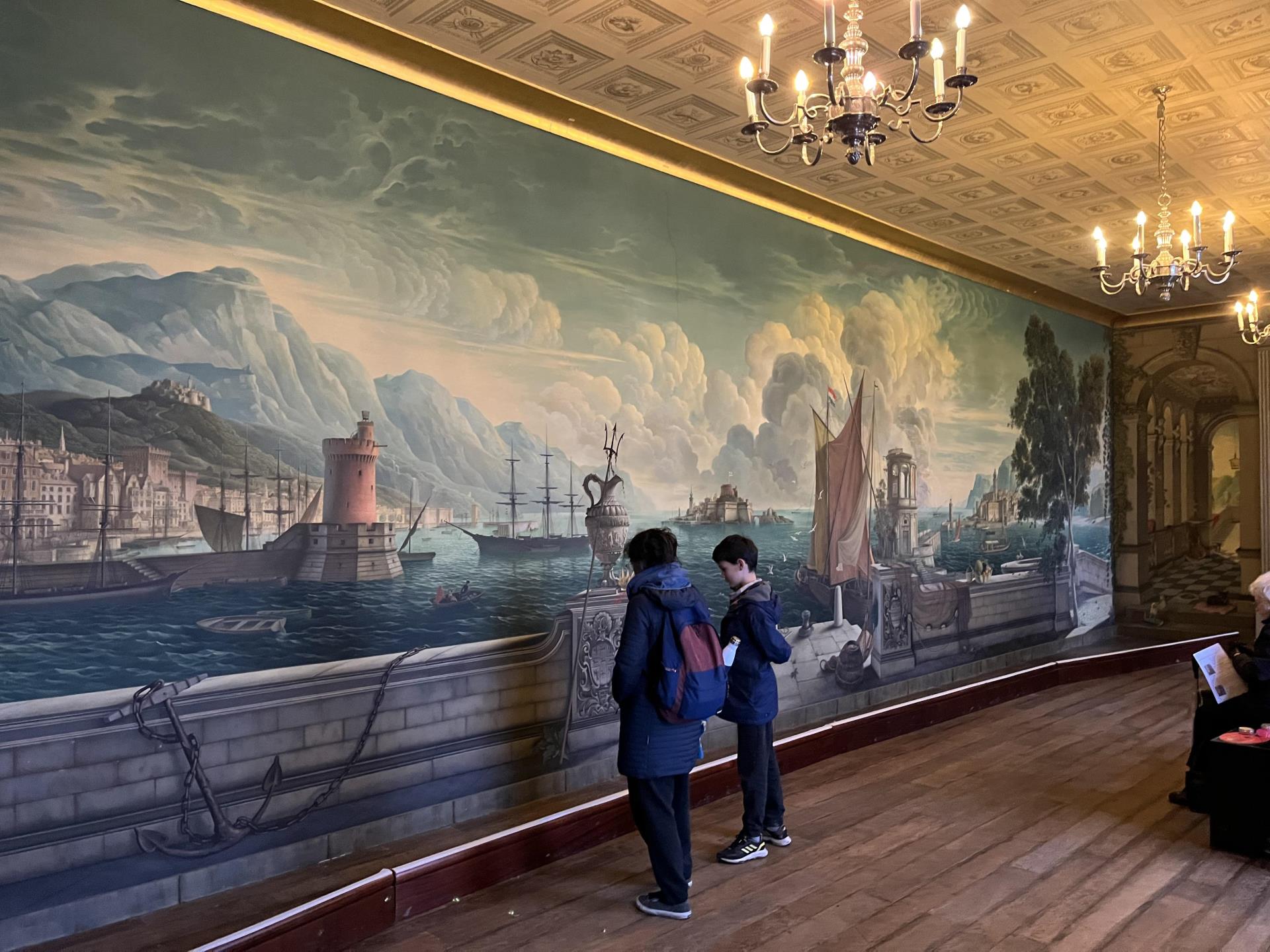 Clients looking at mural in Plas Newydd