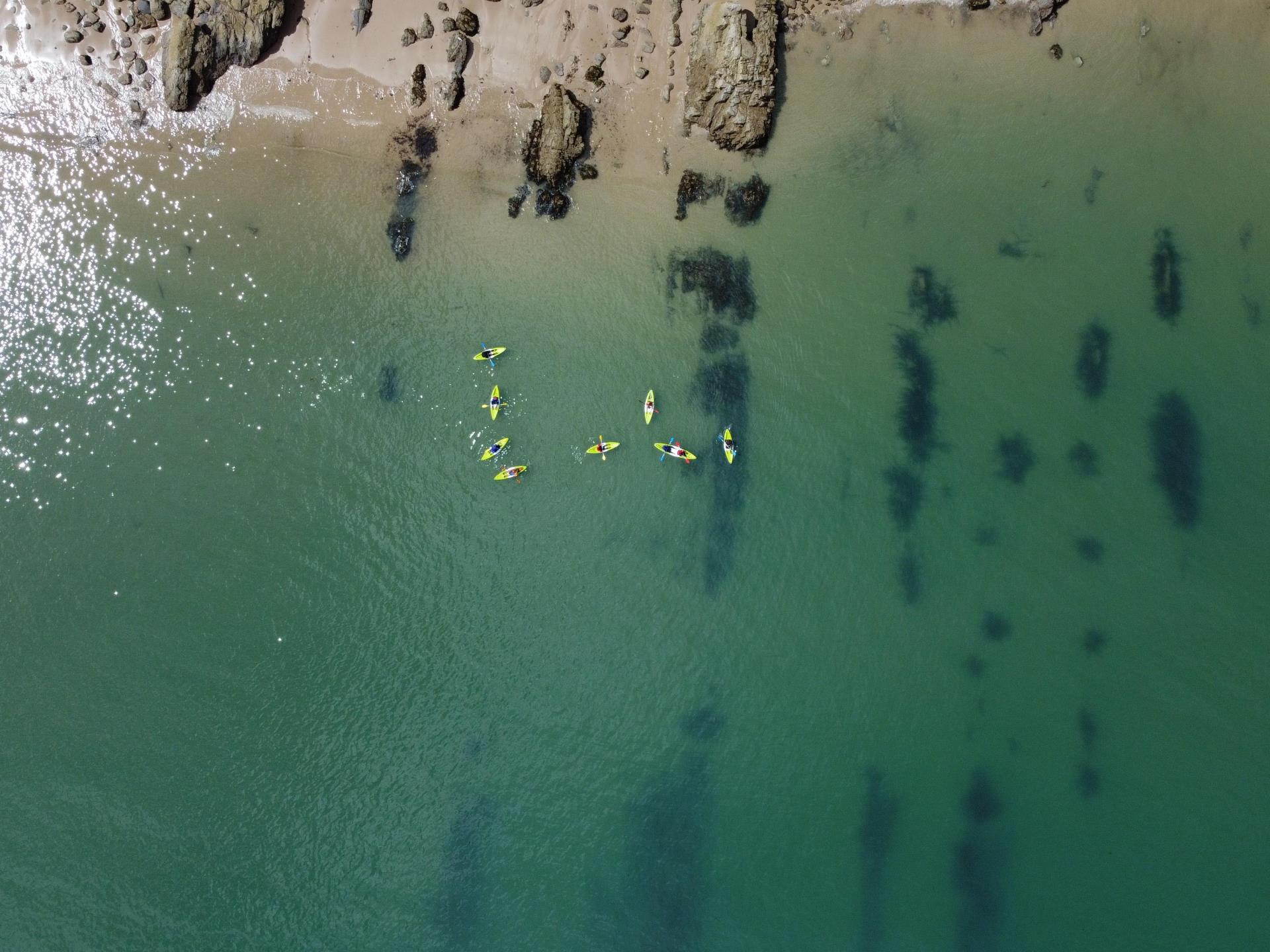 Kayaking the clear water near Tenby