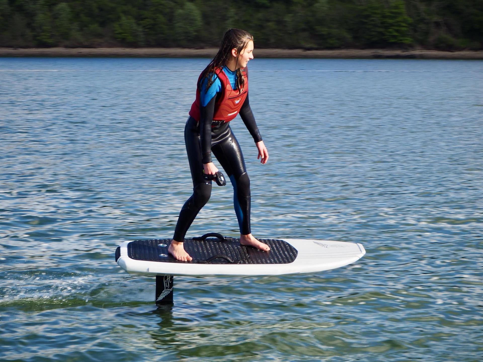 Girl riding efoil in anglesey