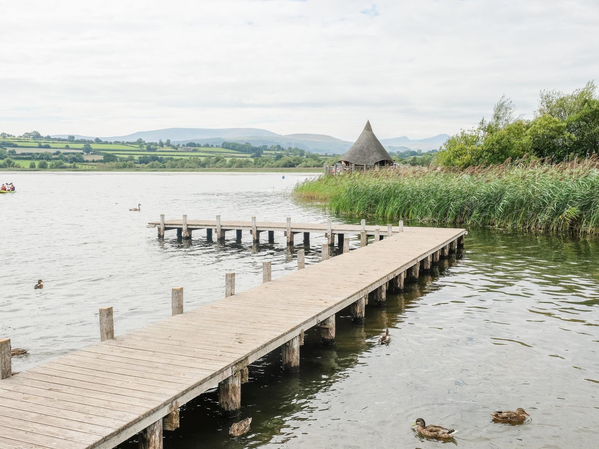 View of the Crannog Centre and the Brecon Beacons
