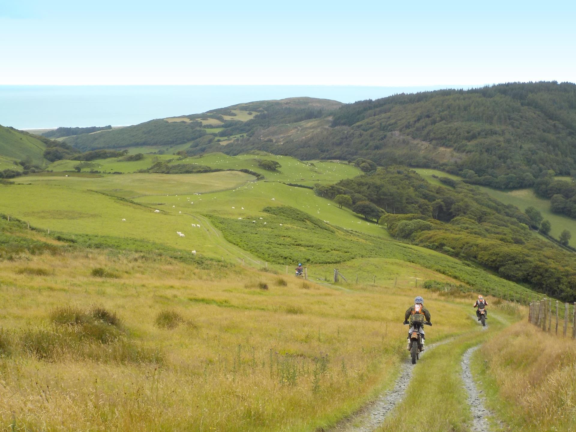 Three riders on a gravel road