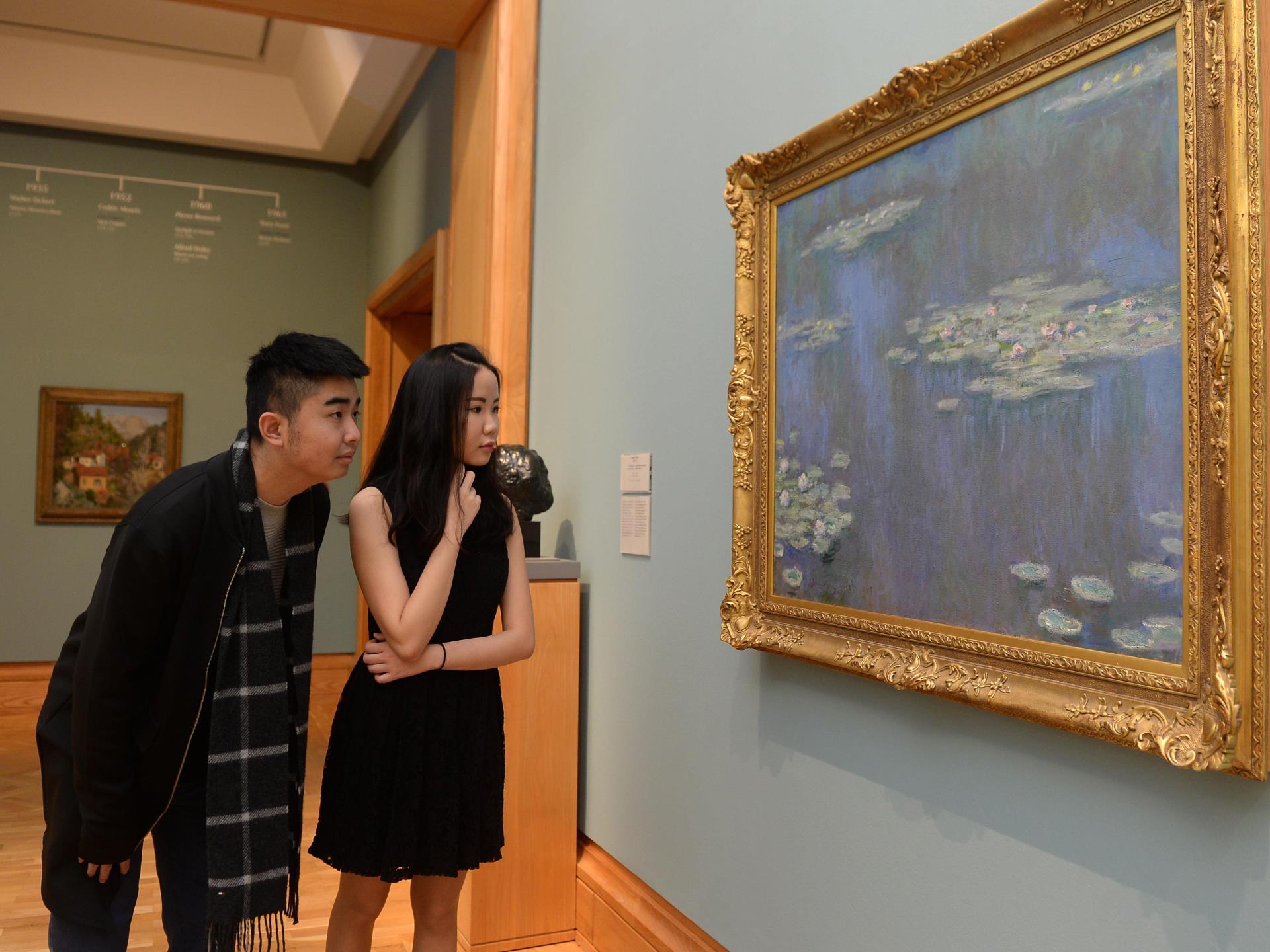 Visitors viewing Monet painting