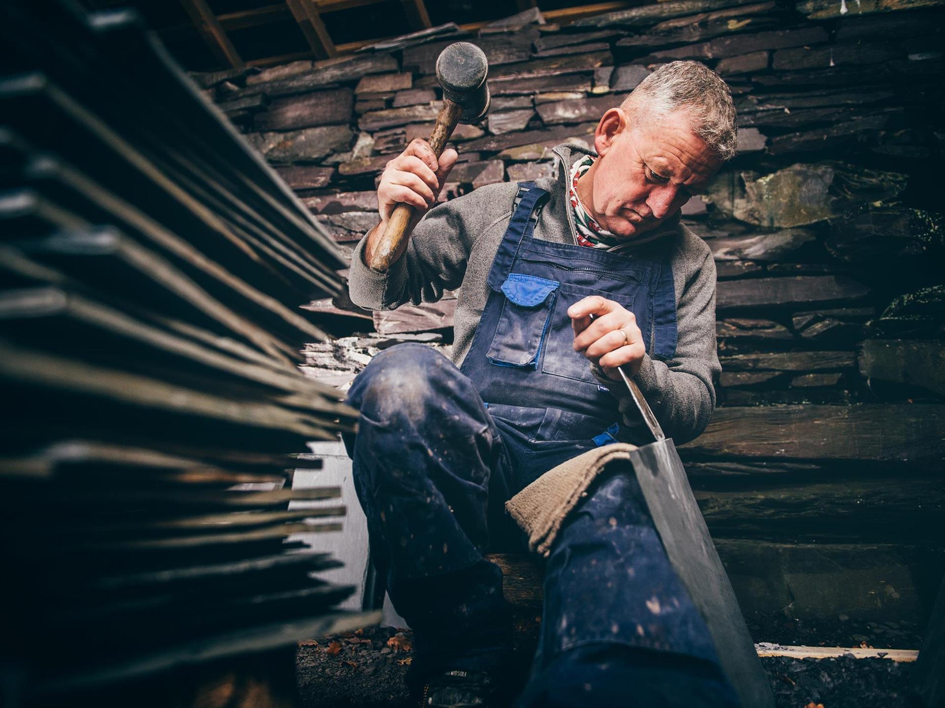 craftsman splitting a slate