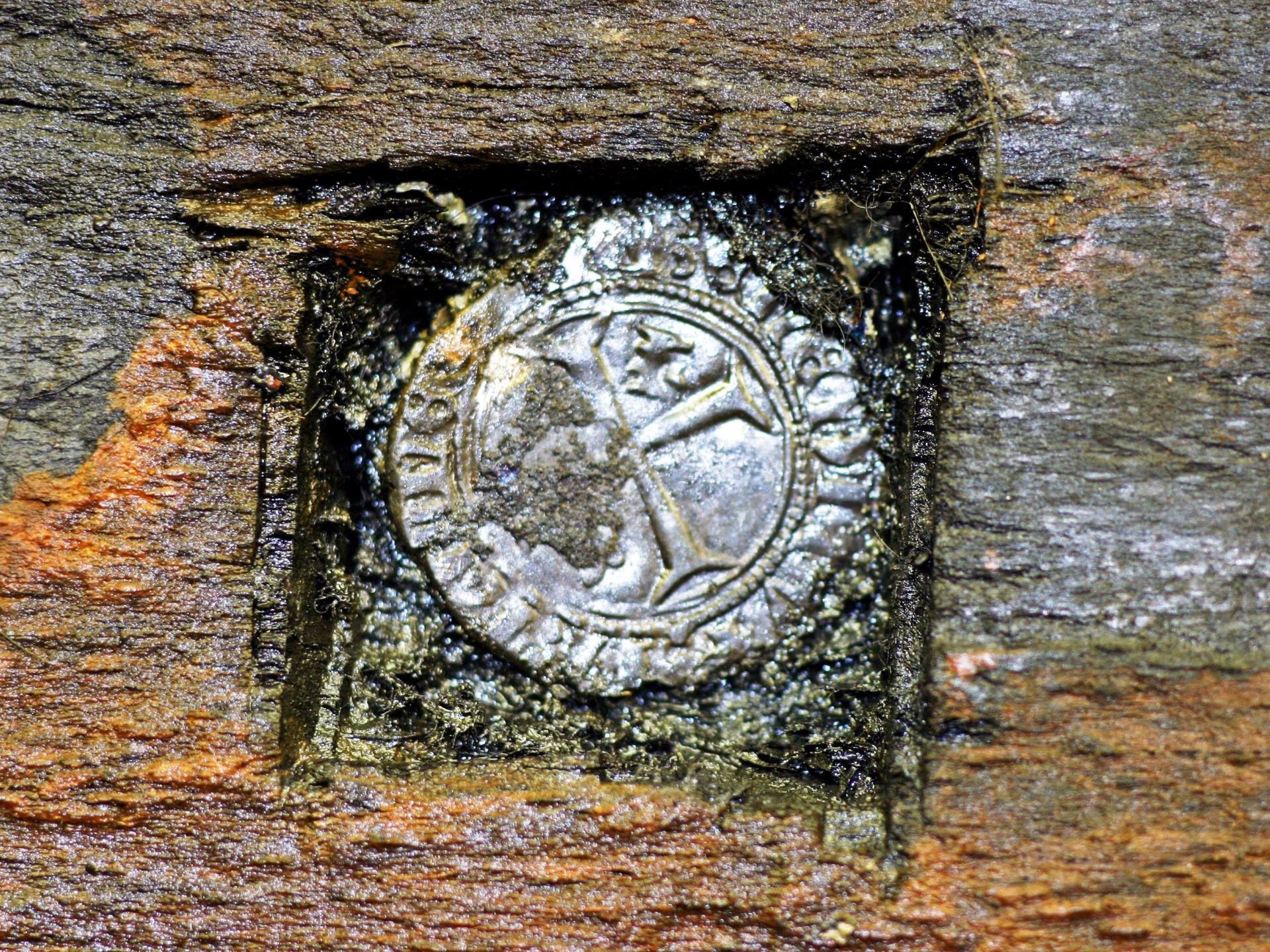 A silver French coin found hidden in the keel.