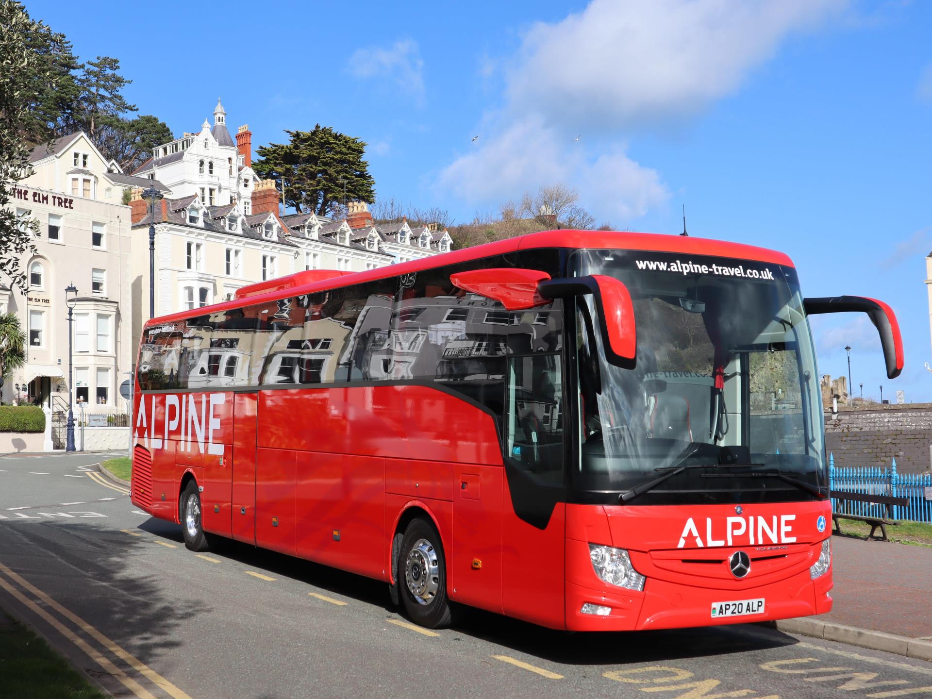 Alpine coach by the pier Llandudno