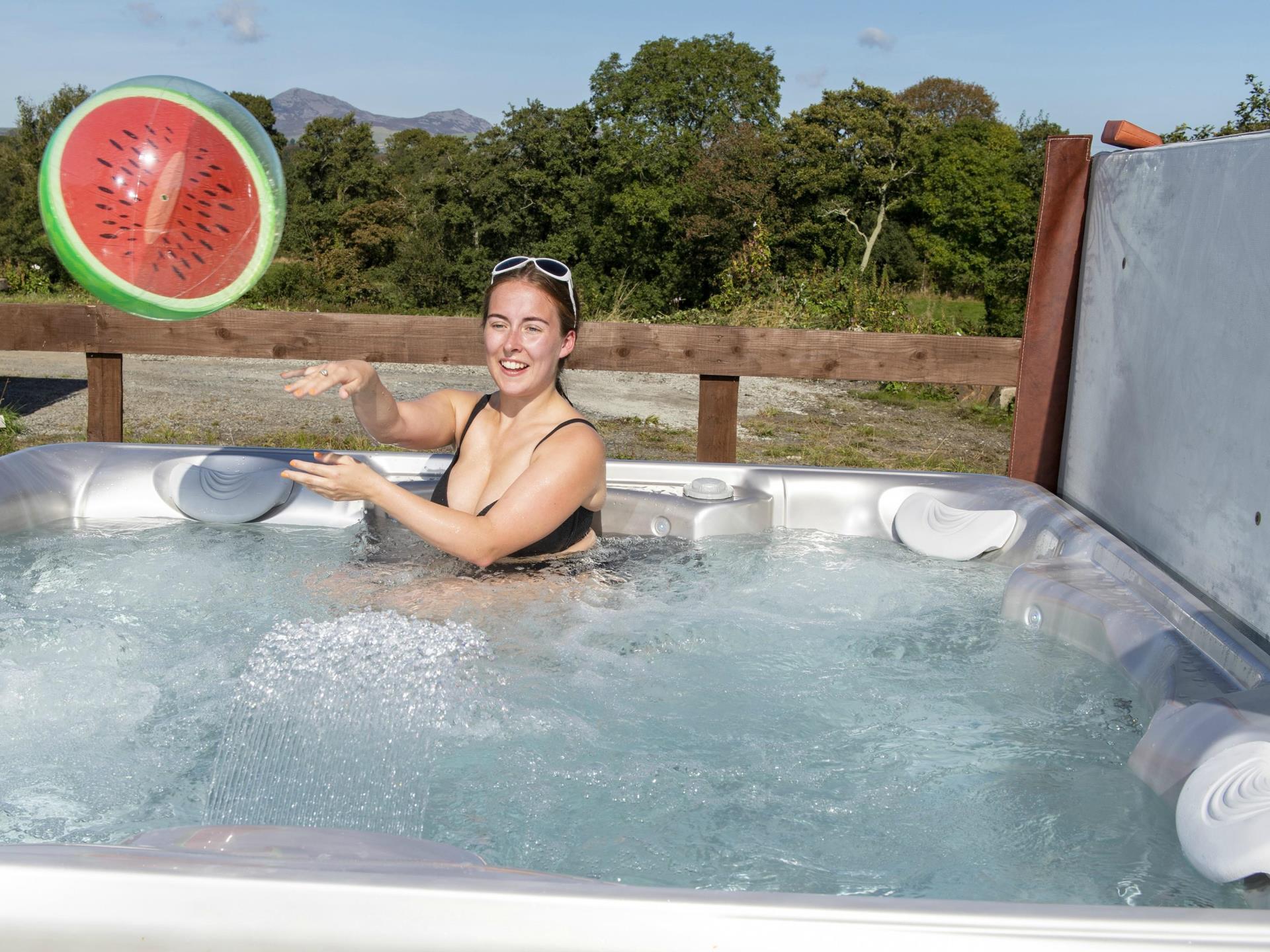 Enjoy the Hot tub at Llwynbeuno Cottage