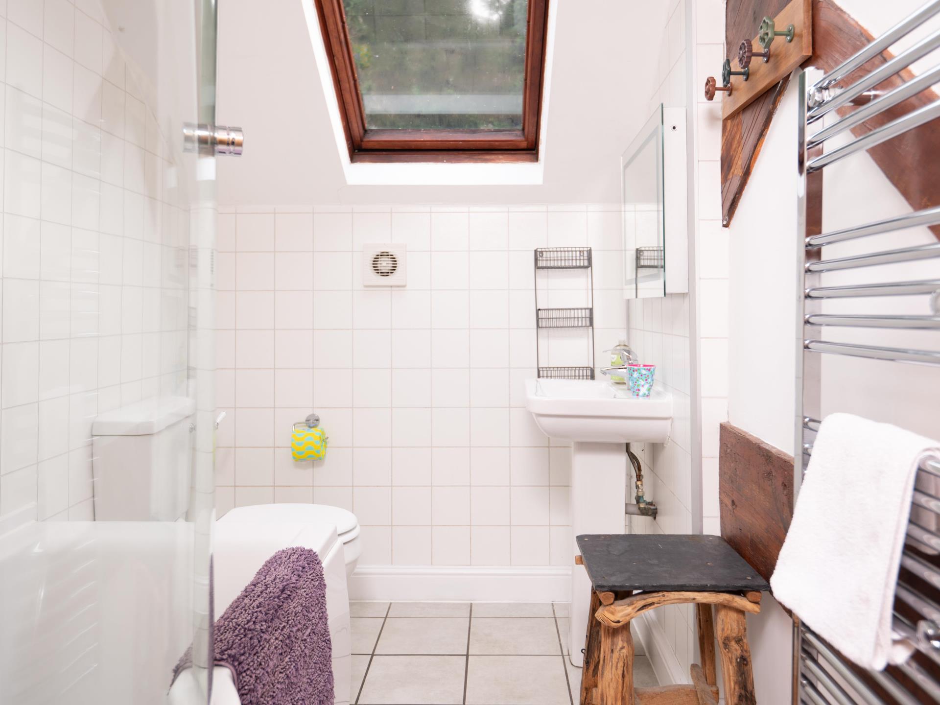 Bathroom with bath and shower