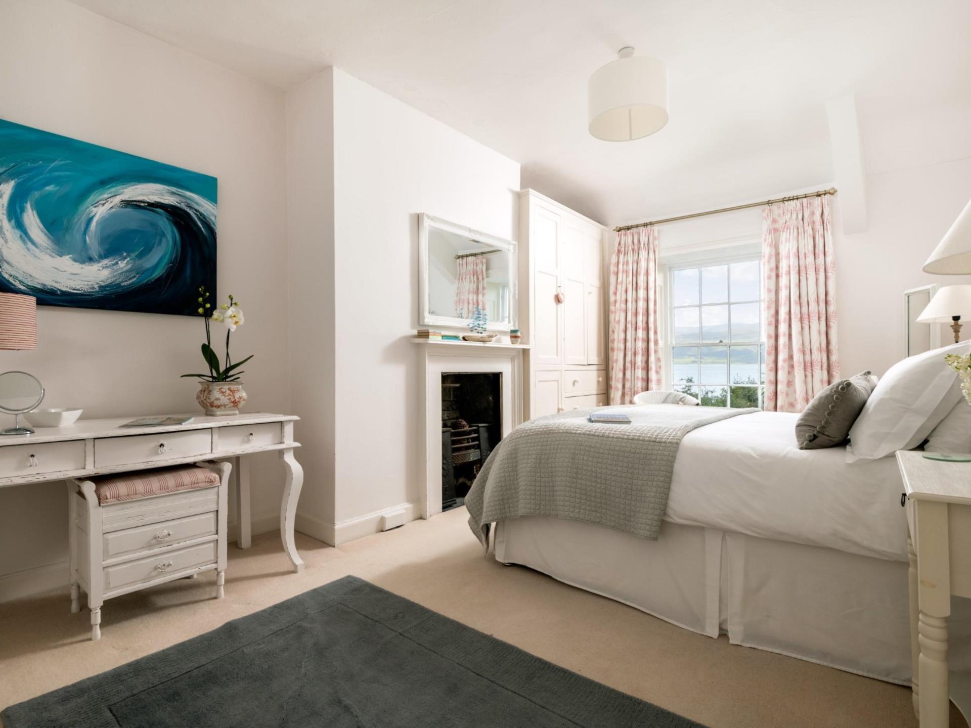An upstairs King bedroom with sea views