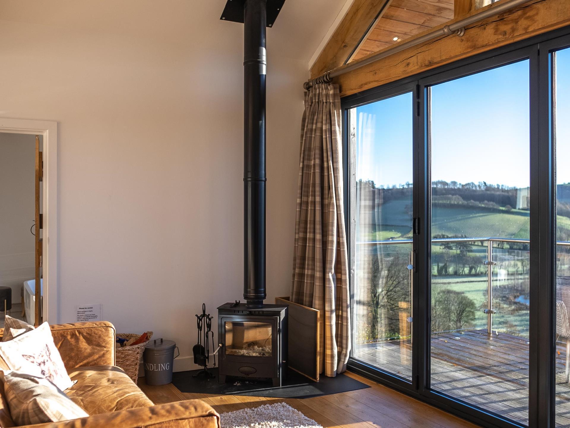 Living area with log burner and incredible views