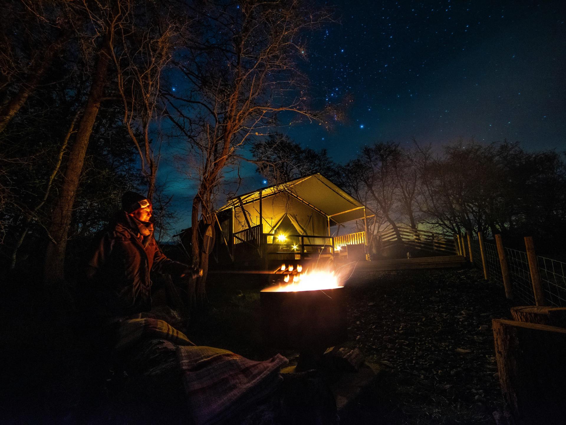 The Fire pit and pizza oven under starry skies