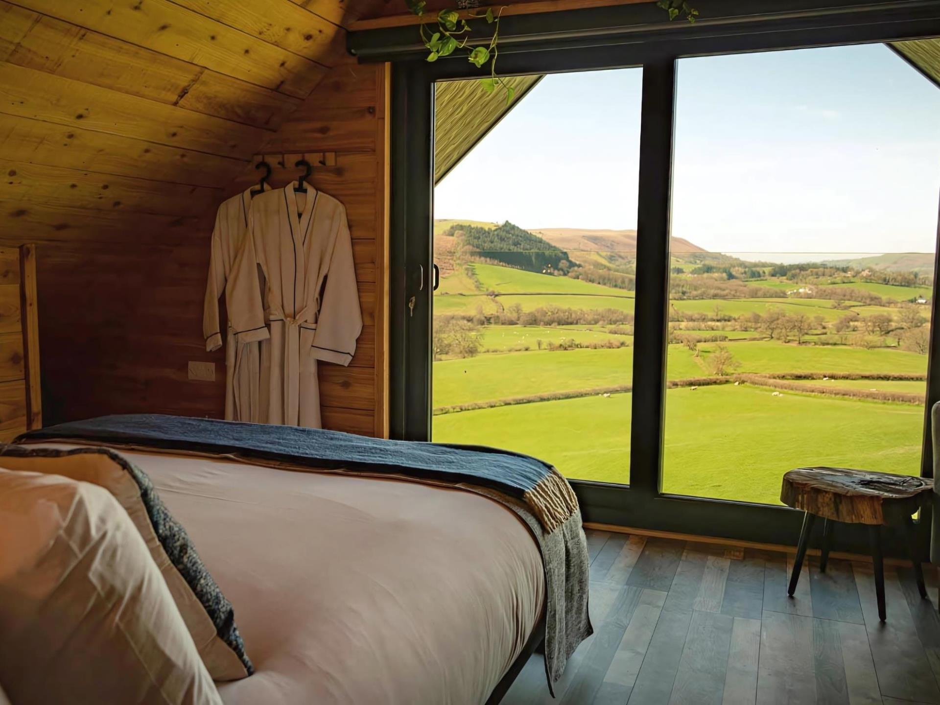 Master bedroom offers a floor-to-ceiling window.