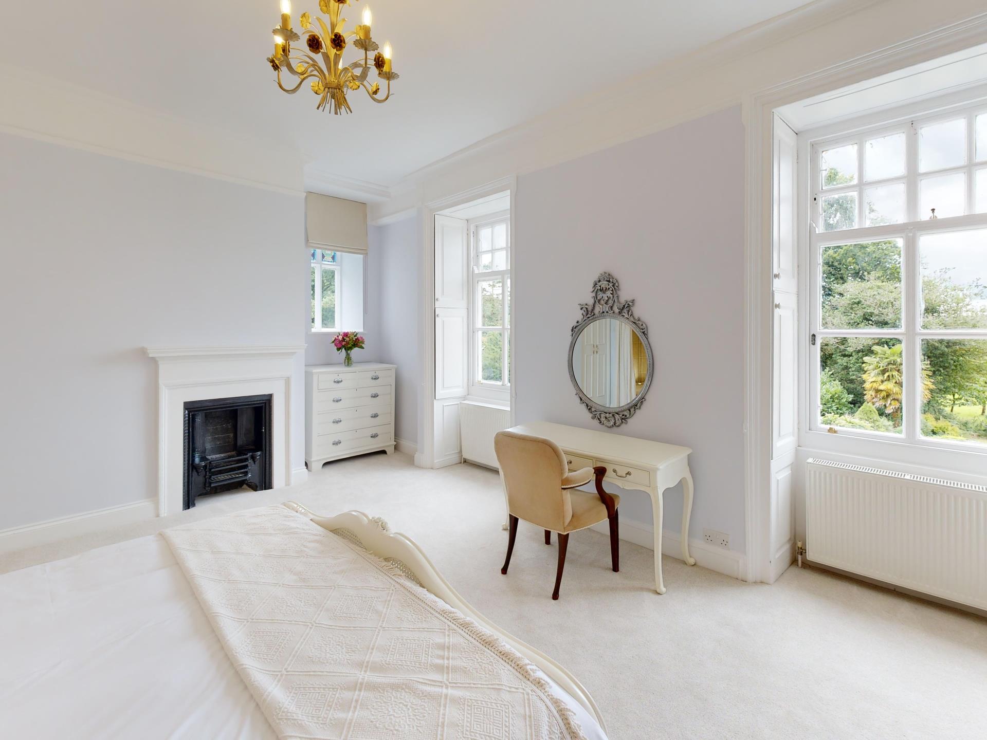 Elegant Manor Bedroom with Garden Views