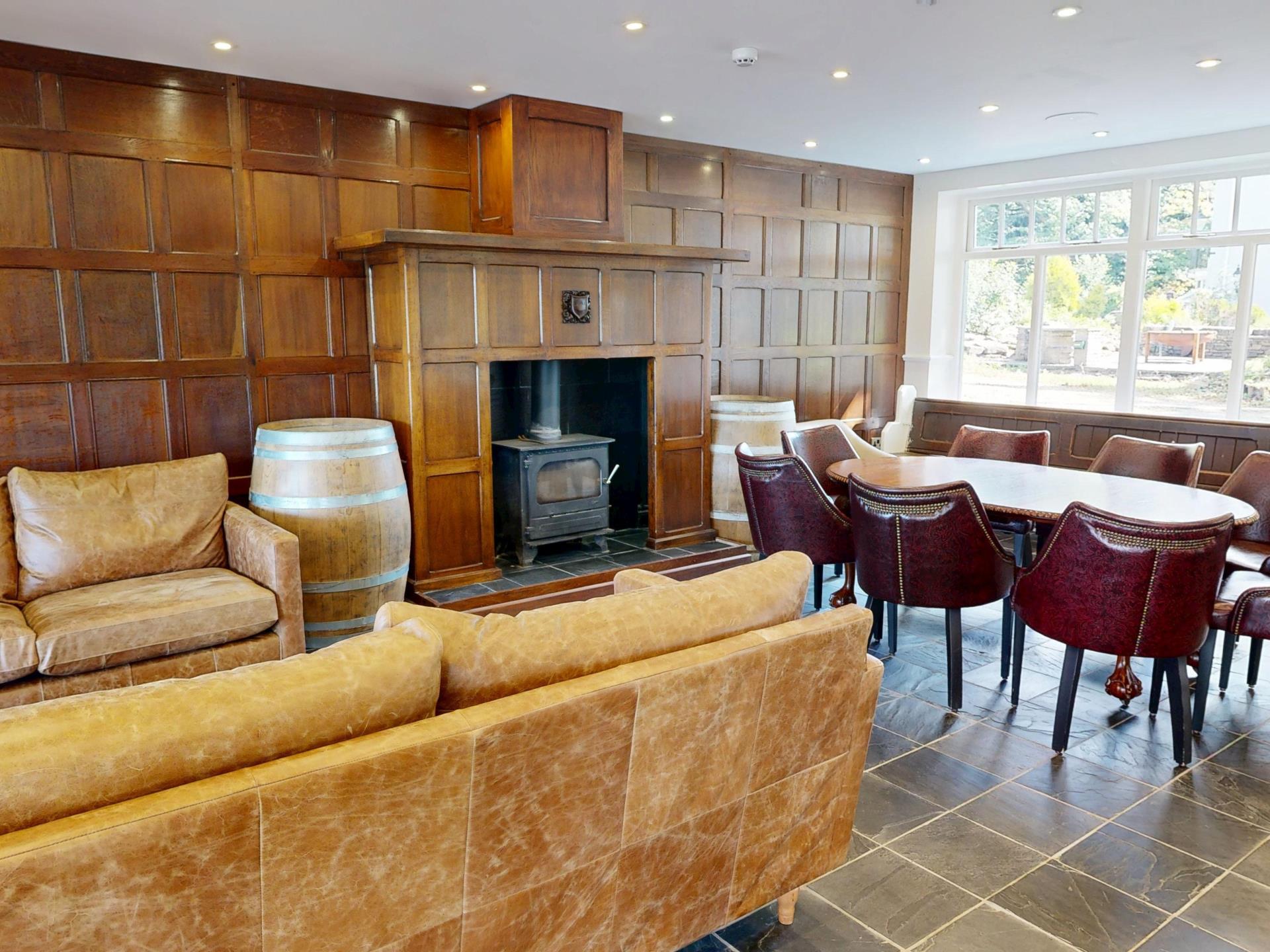 Cosy Manor Lounge with Log Burner and Leather Sofa