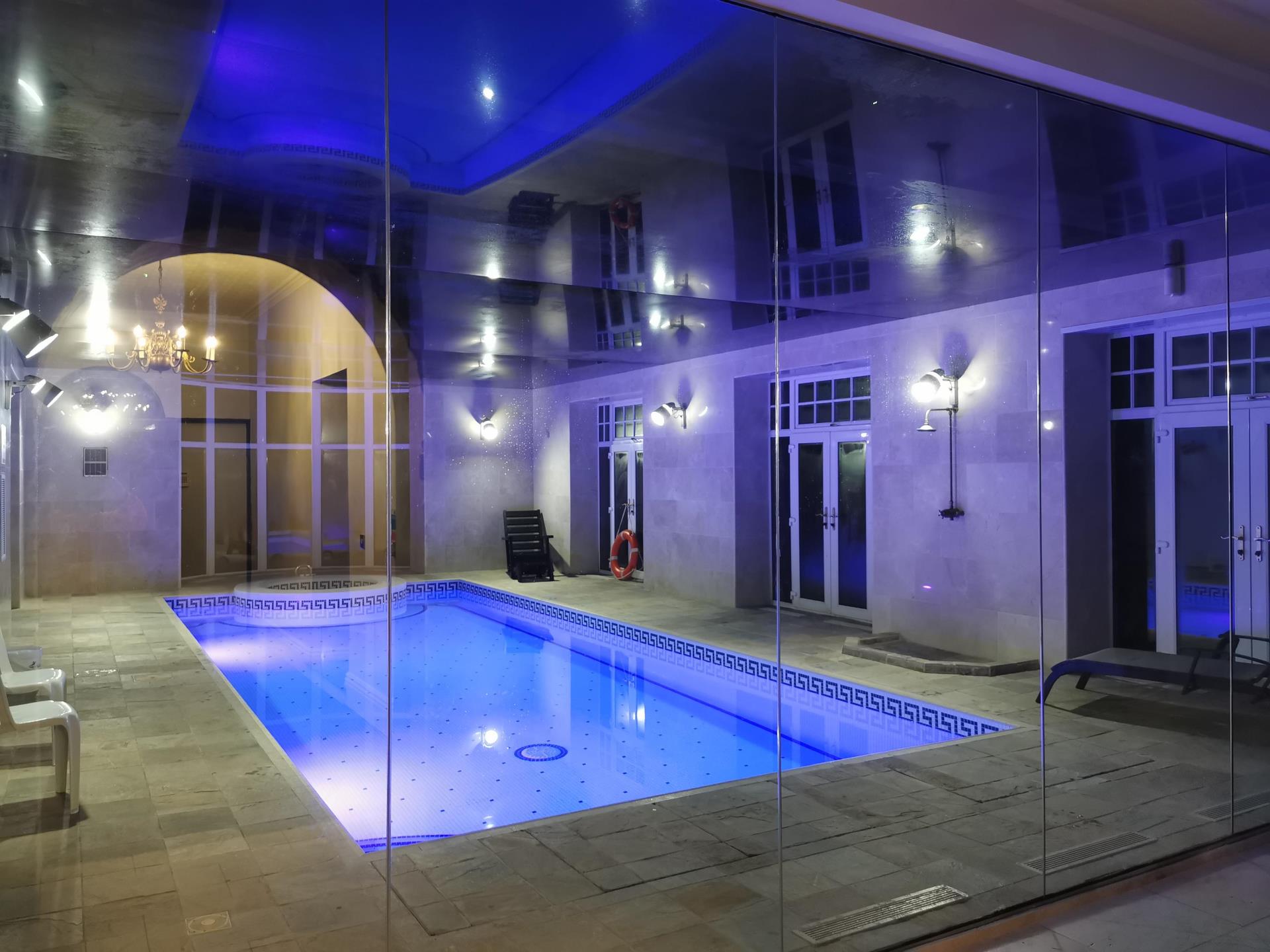 Luxury Indoor Pool with Ambient Lighting