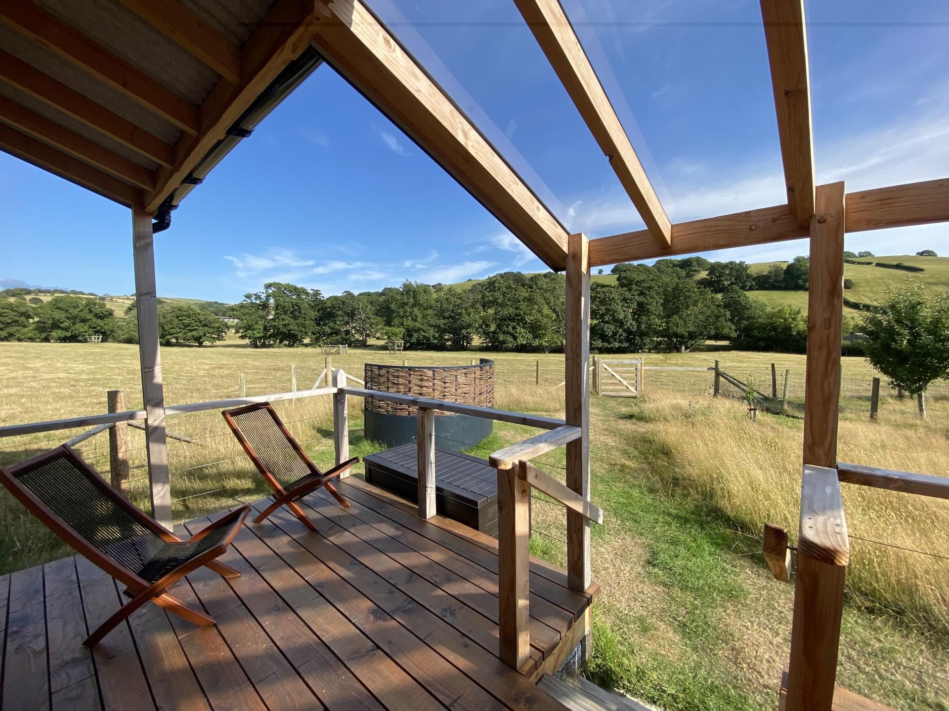 Luxury cabin with covered outdoor deck area. 