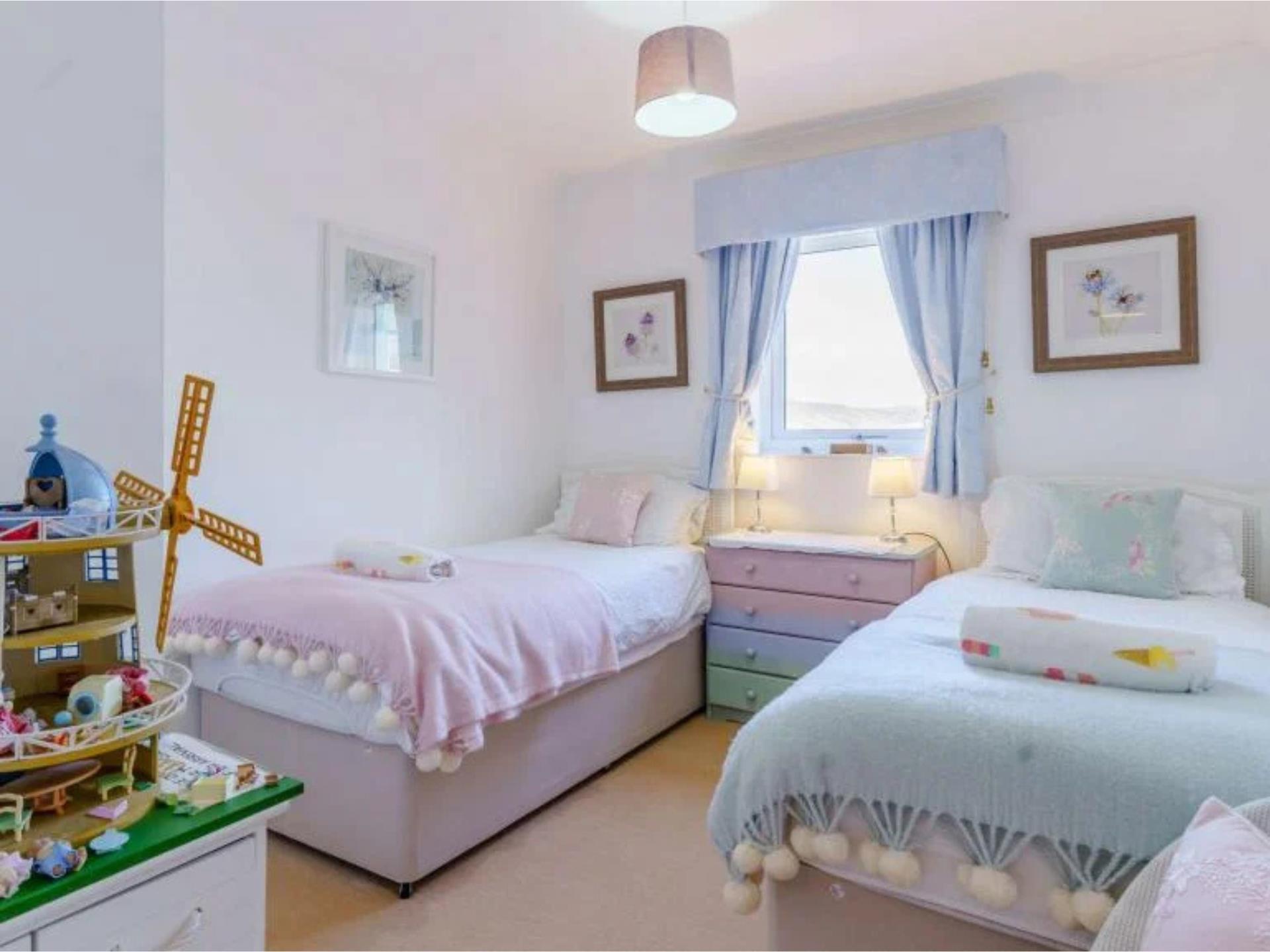 Twin bedroom with kid surprises