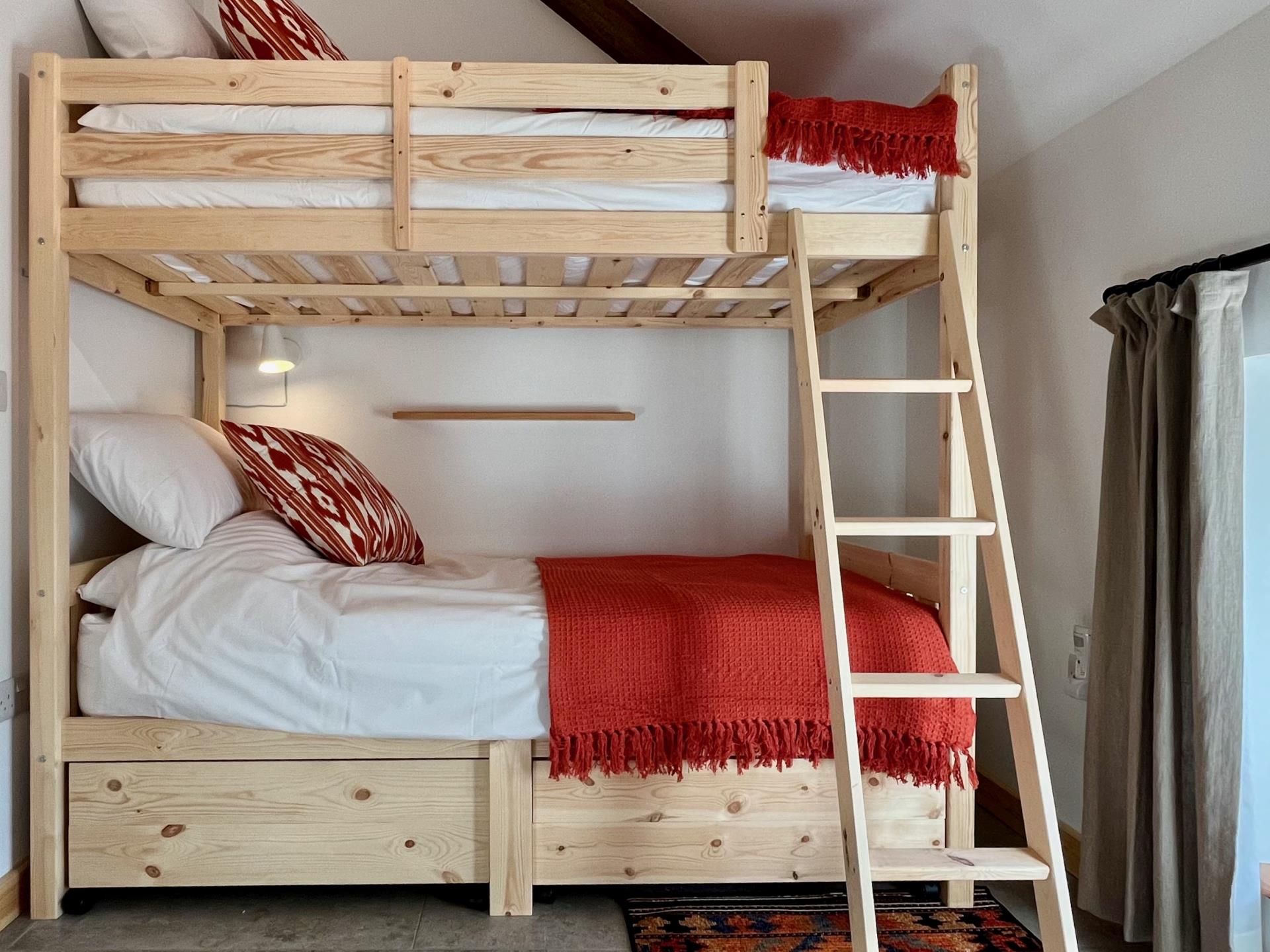 The second bedroom includes bunk beds