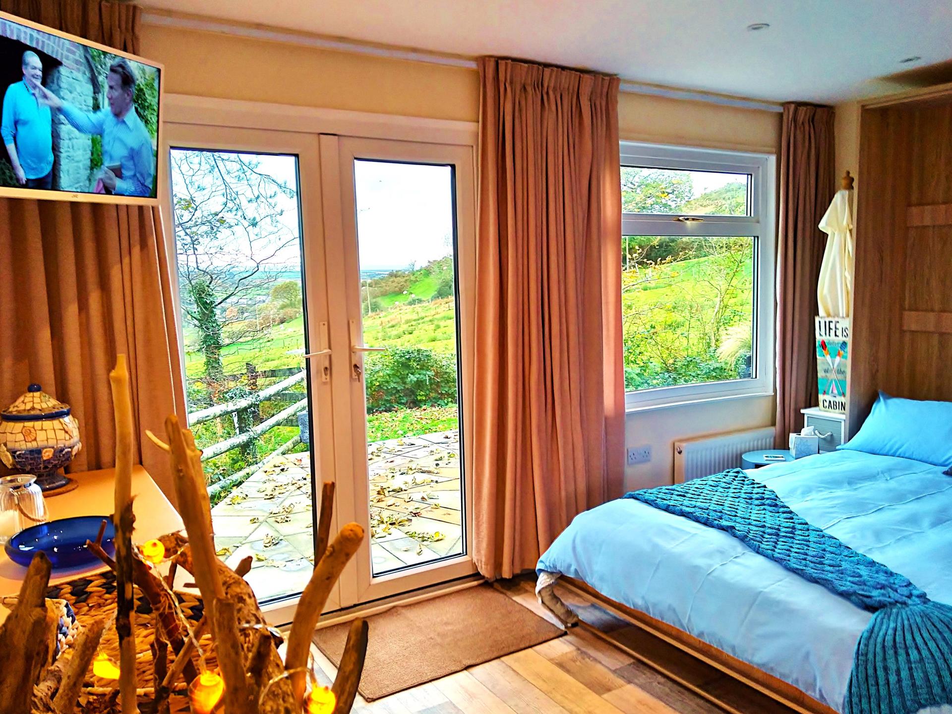 TV Double Bed and French Doors to the Patio