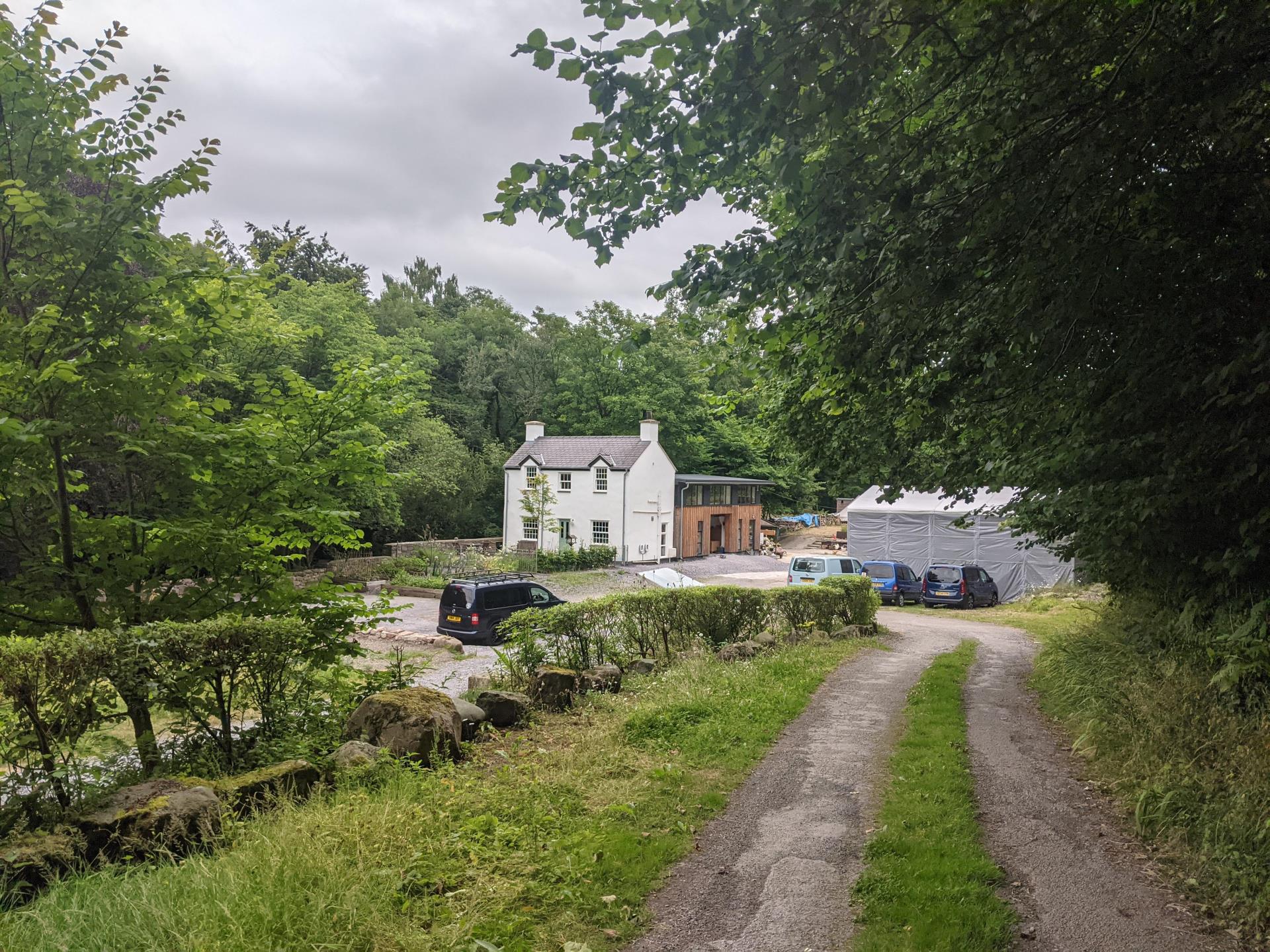 The cottage and workshop behind.