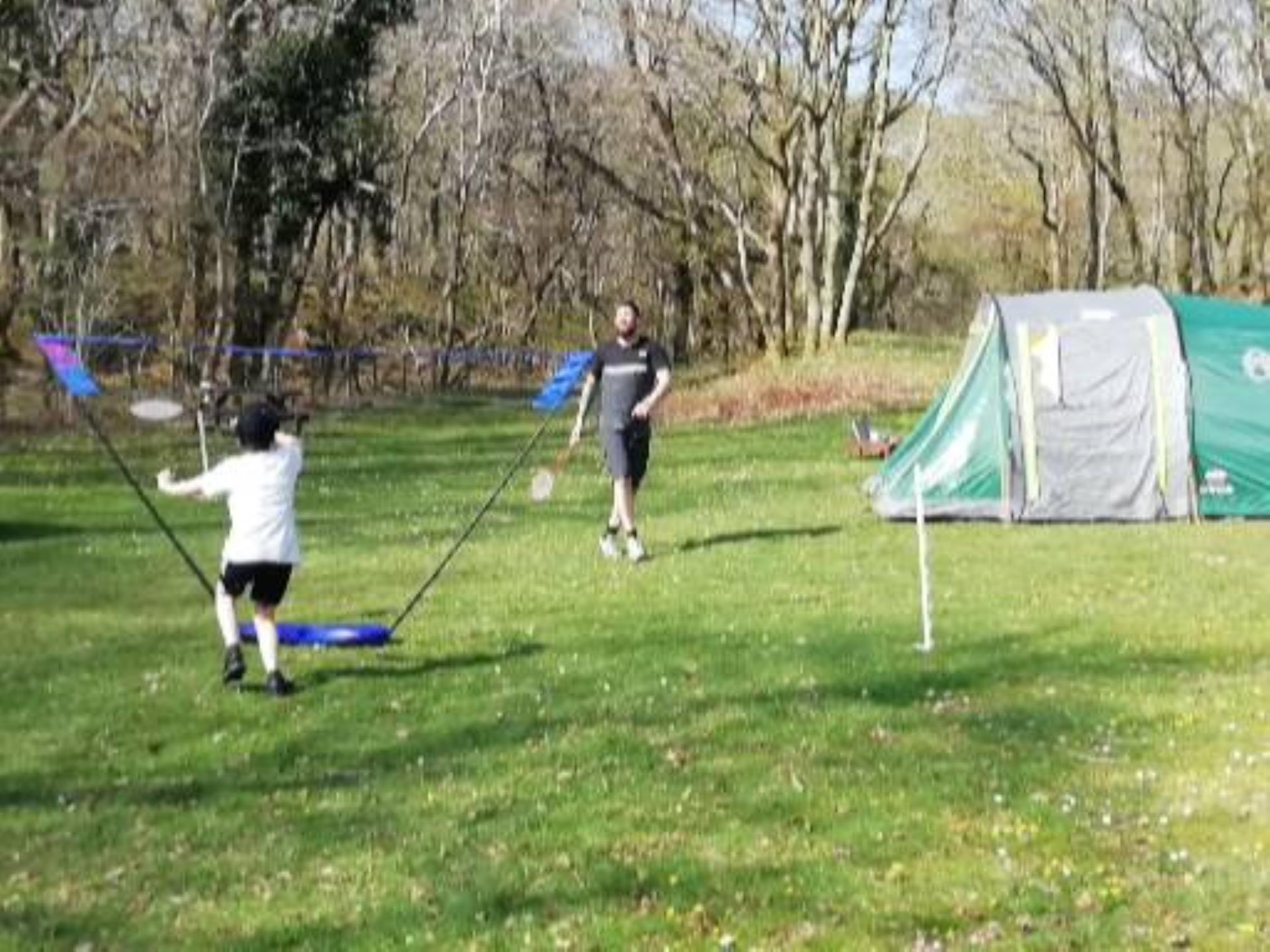 Campers playing badminton