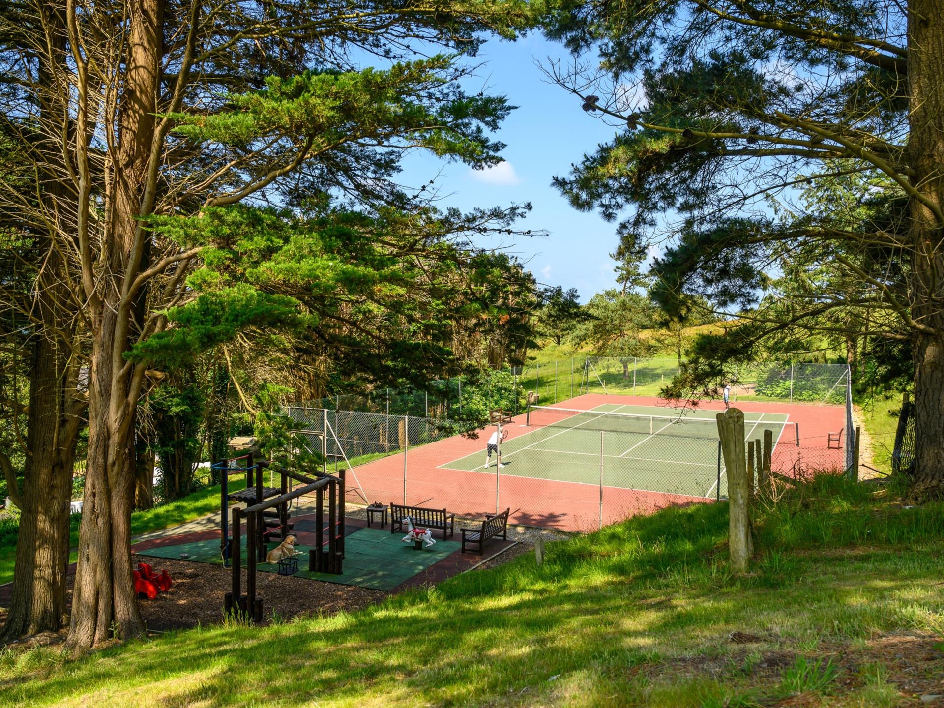Hotel tennis court and play area