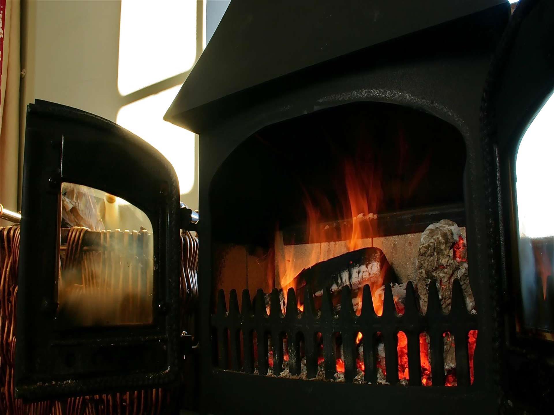 Log burner in holiday cottage in coastal Mid Wales