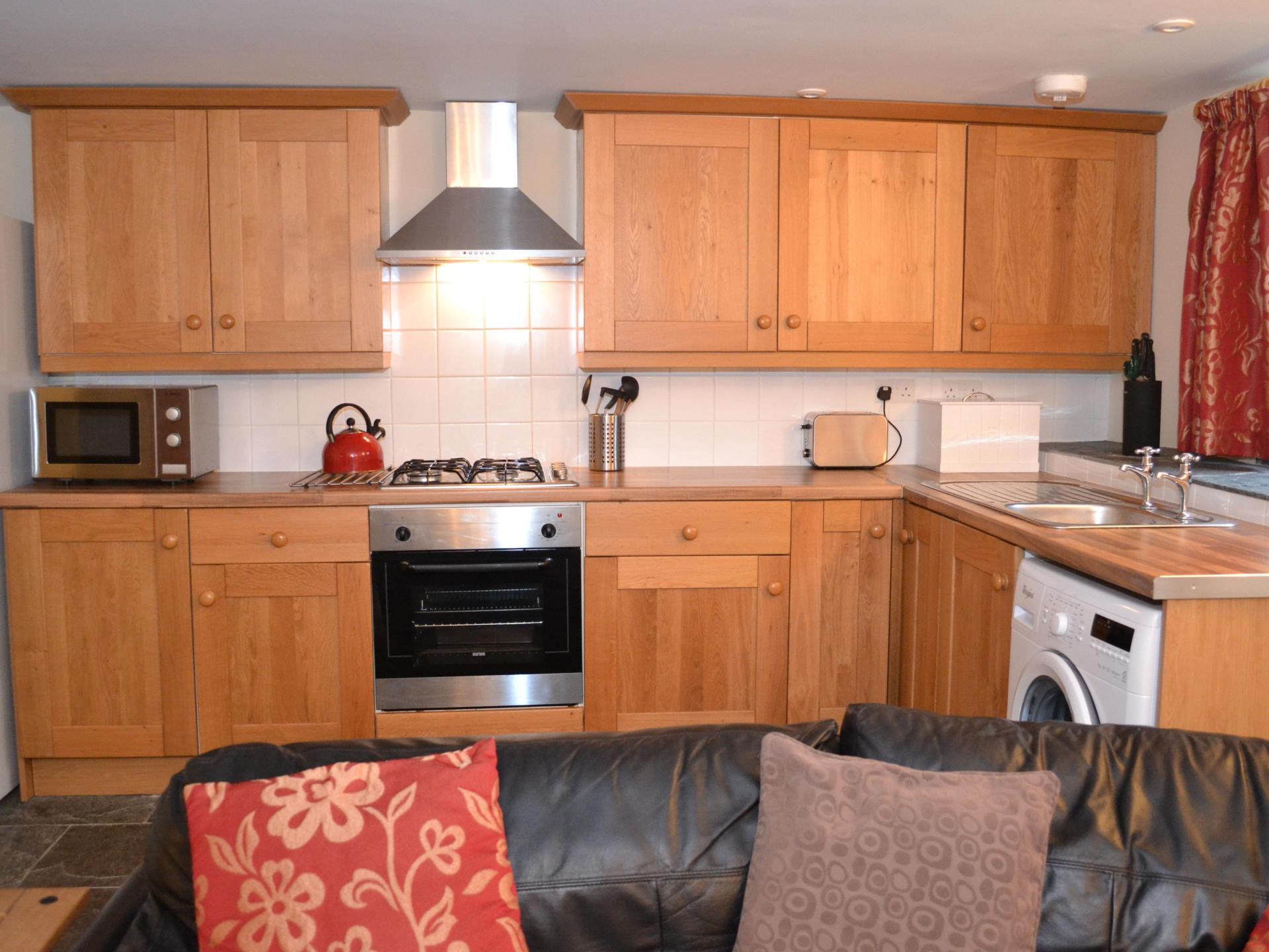 Kitchen and sofa in Hafren Cottage at Wye View
