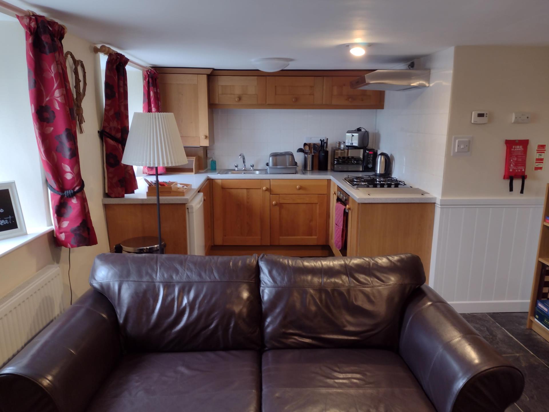 Kitchen and lounge in Severn Cottage at Wye View