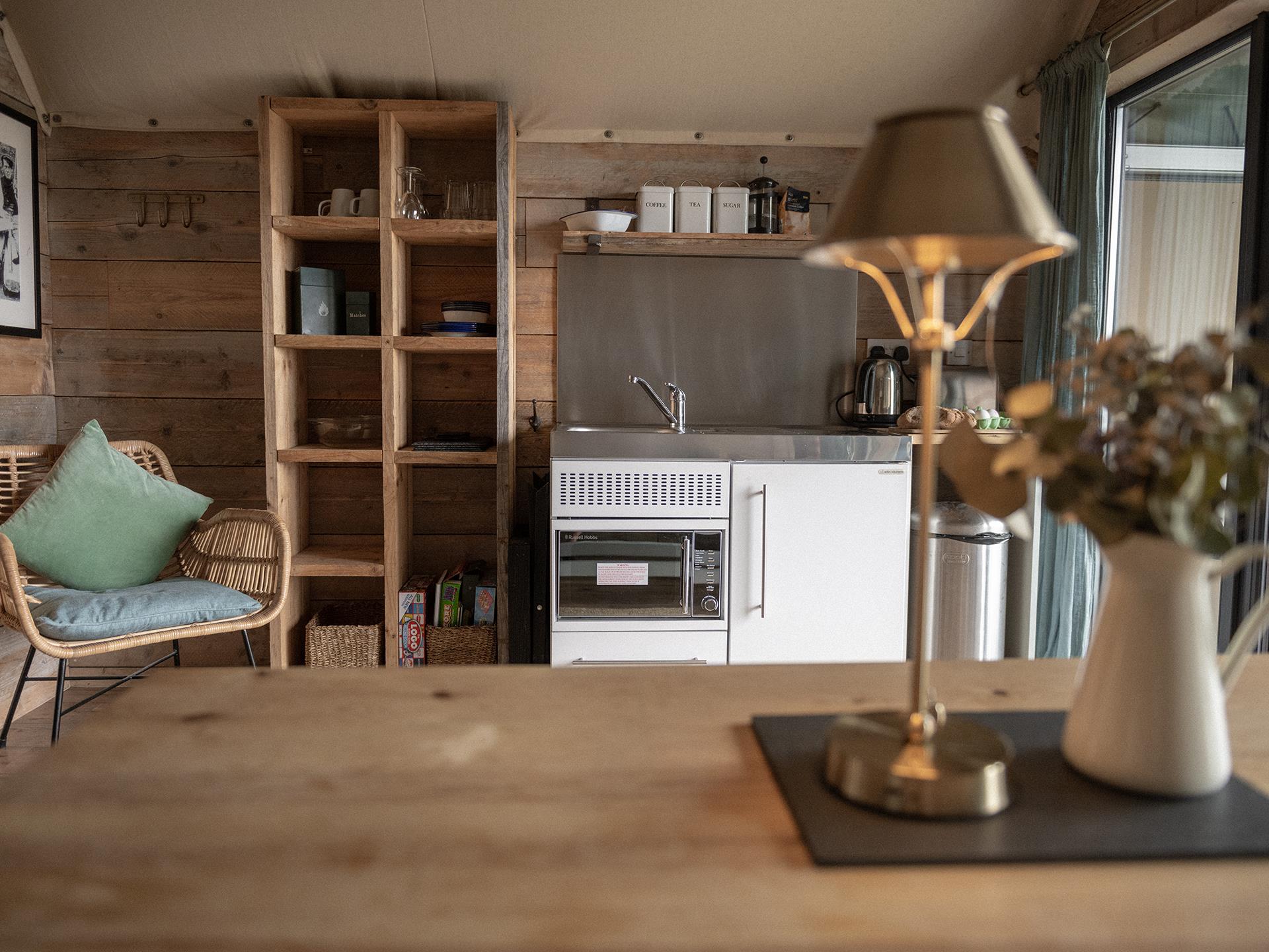 Kitchenette with hob, microwave, sink, kettle