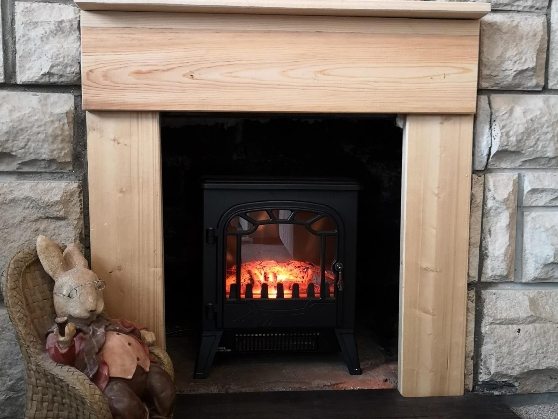 Fireplace with electric woodburner fire