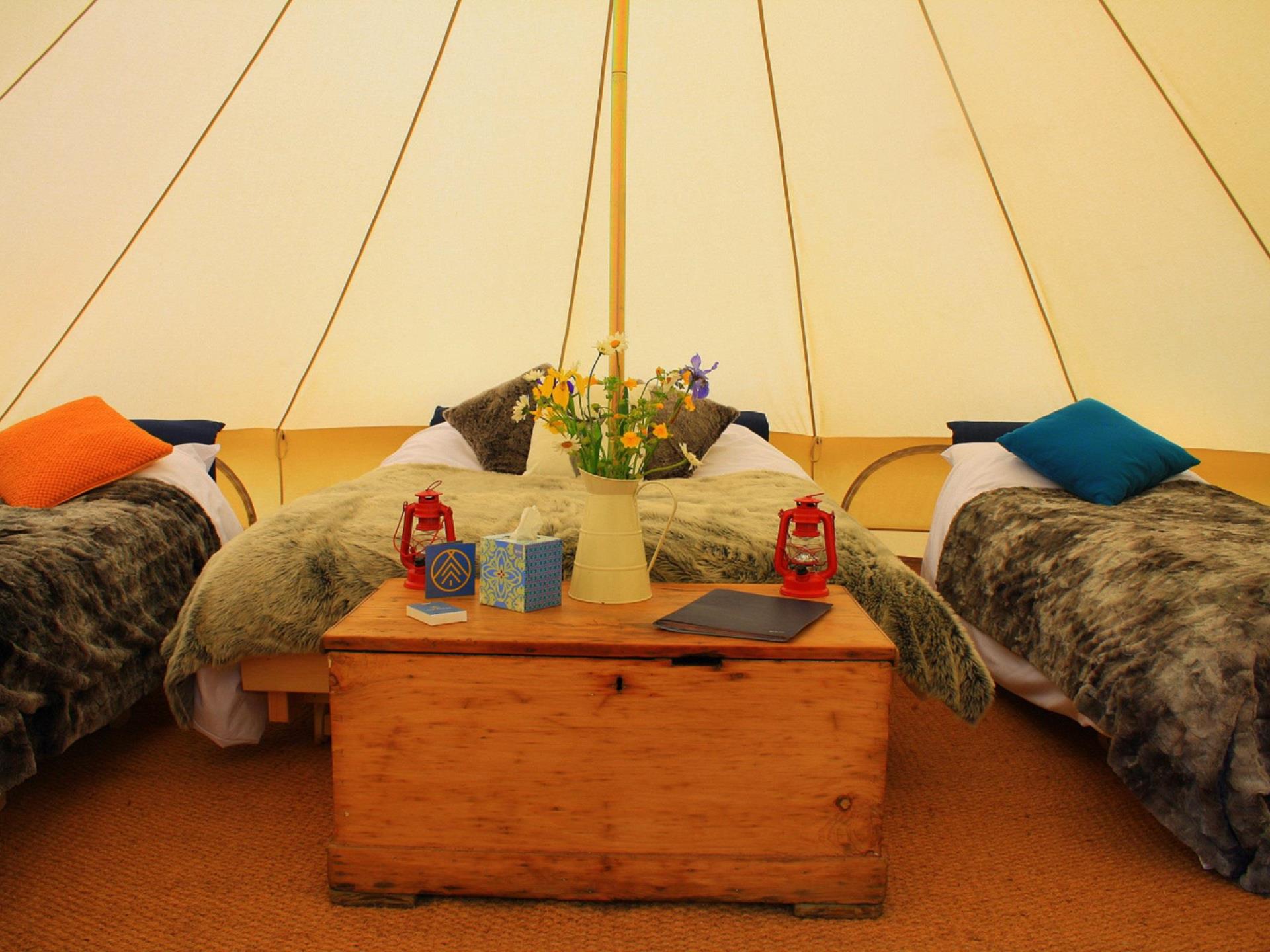 All our tents come with real beds and carpets