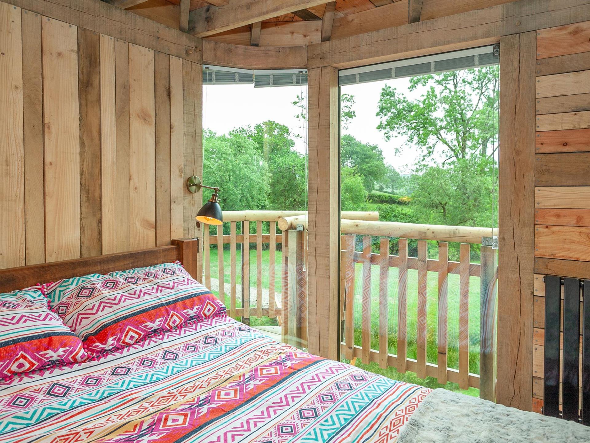 King size bed at Trawscwm Treehouse