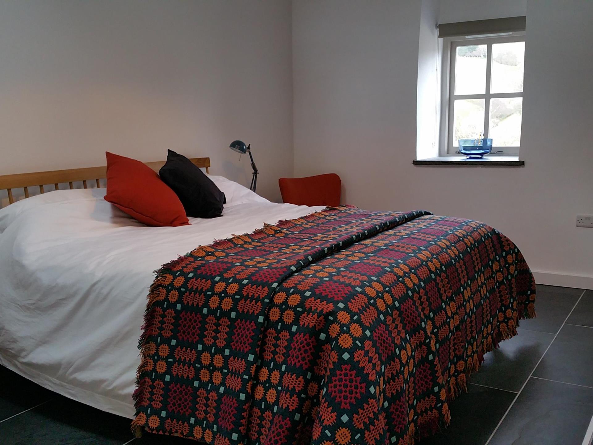 Owl/ Gwdihw bedroom with traditional Welsh blanket